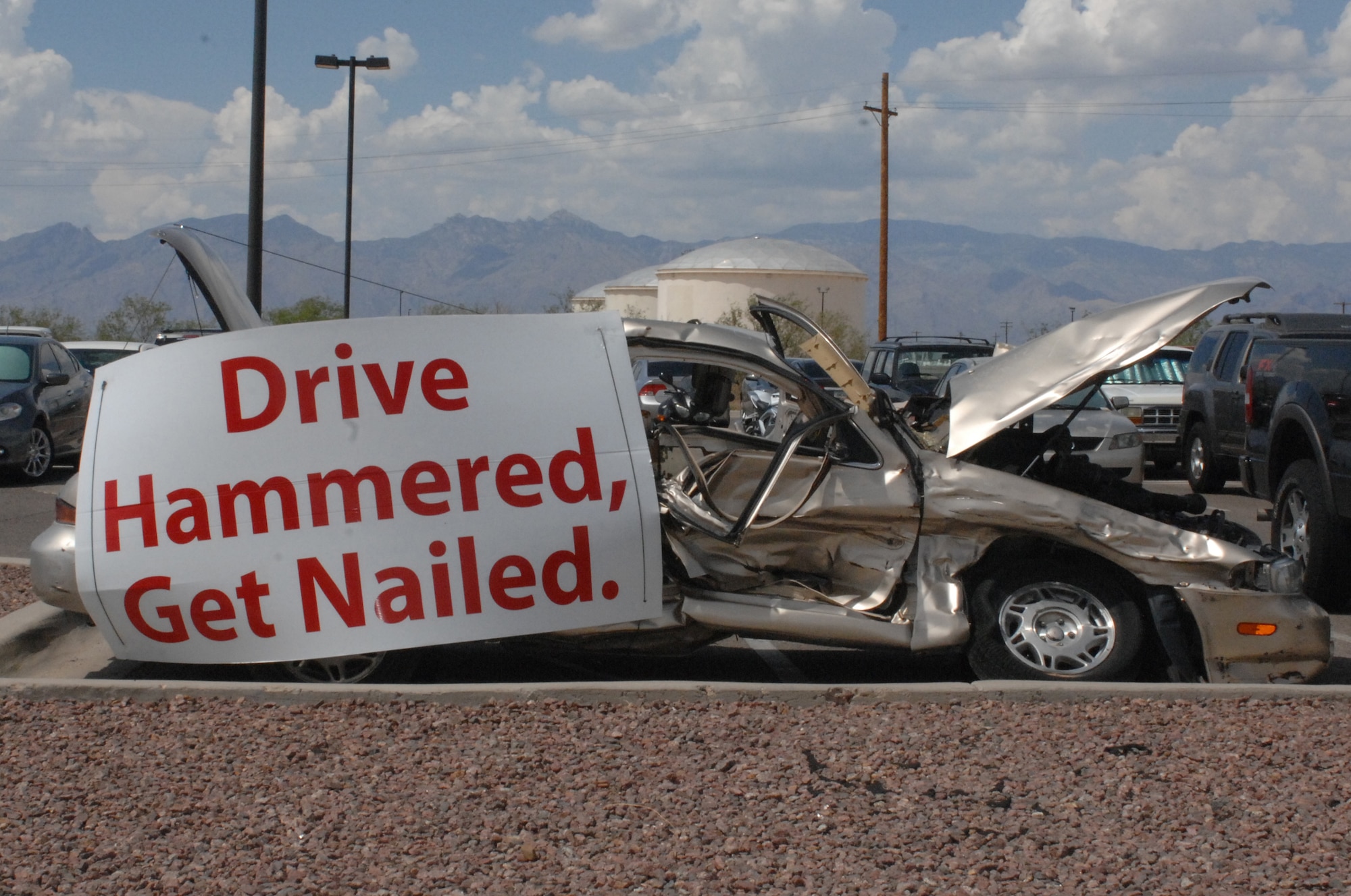 A car sits in the 755th Aircraft Maintenance Squadrons parking lot to represent a drunk driving accident at July 15, 2013, at Davis-Monthan Air Force Base, Ariz. (U.S. Air Force photo/Airman 1st Class Betty Chevalier)