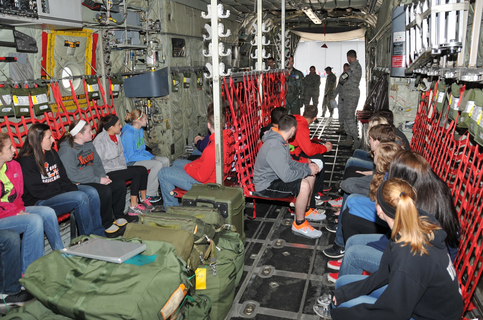 Members of the 179th Airlift Wing organize an event to help develop student athletes from the Northern 10 Athletic Conference, April 8, 2014, Galion, OH. The student athletes were seperated into teams unrelated to their schools and rotated through 6 stations designed to develop leadership skills and familiarity of Air Force customs.The students are shown getting a tour of a C-130H Hercules by the aircrew. (U.S. Air National Guard Photo by TSgt Joseph Harwood \Released)