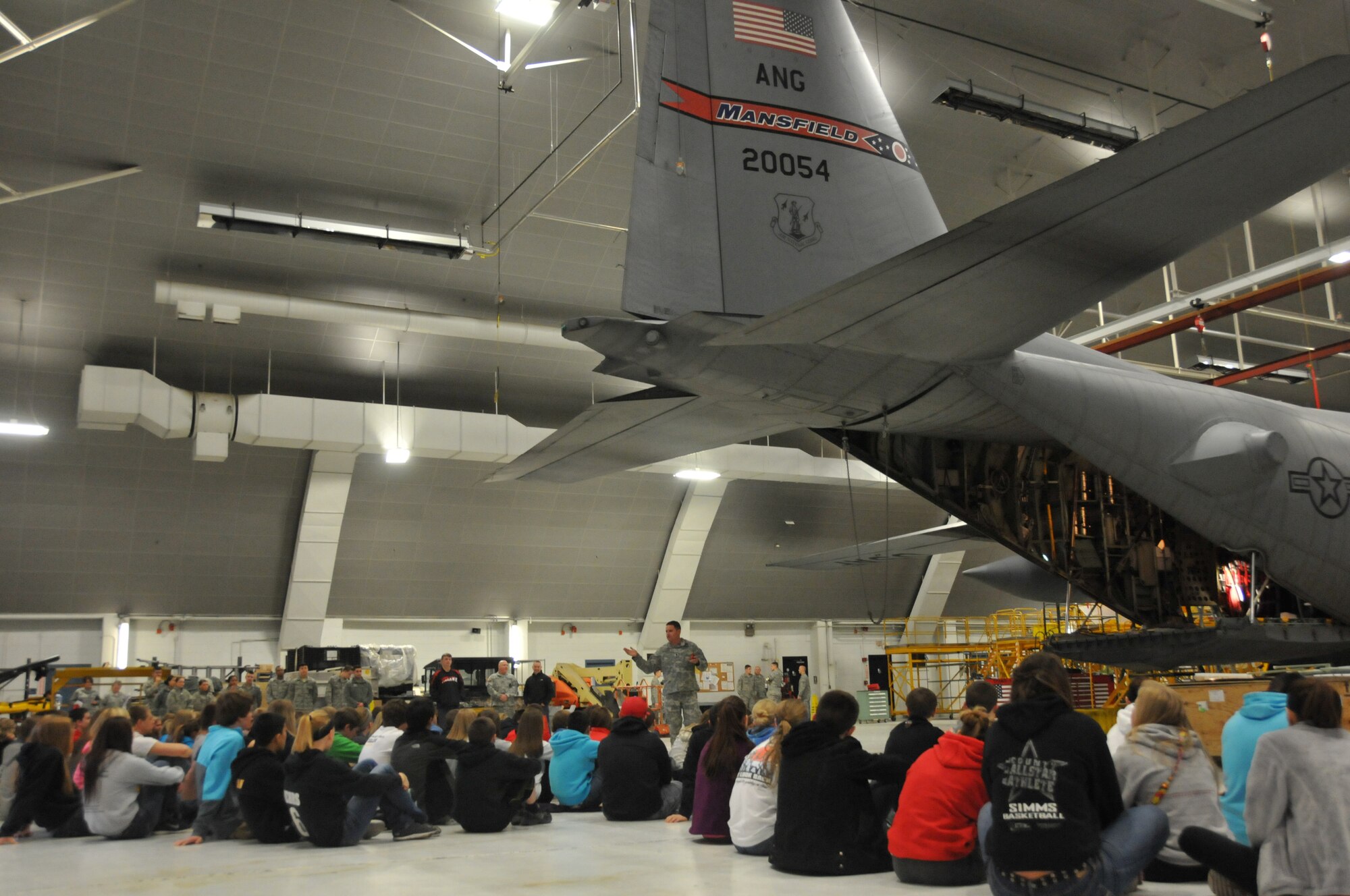 Members of the 179th Airlift Wing organize an event to help develop student athletes from the Northern 10 Athletic Conference, April 8, 2014, Galion, OH. The student athletes were seperated into teams unrelated to their schools and rotated through 6 stations designed to develop leadership skills and familiarity of Air Force customs.Army LtCol Stephen Rhoades, gives a speech on his experience in leadership and the qualities that make up a leader. (U.S. Air National Guard Photo by TSgt Joseph Harwood \Released)