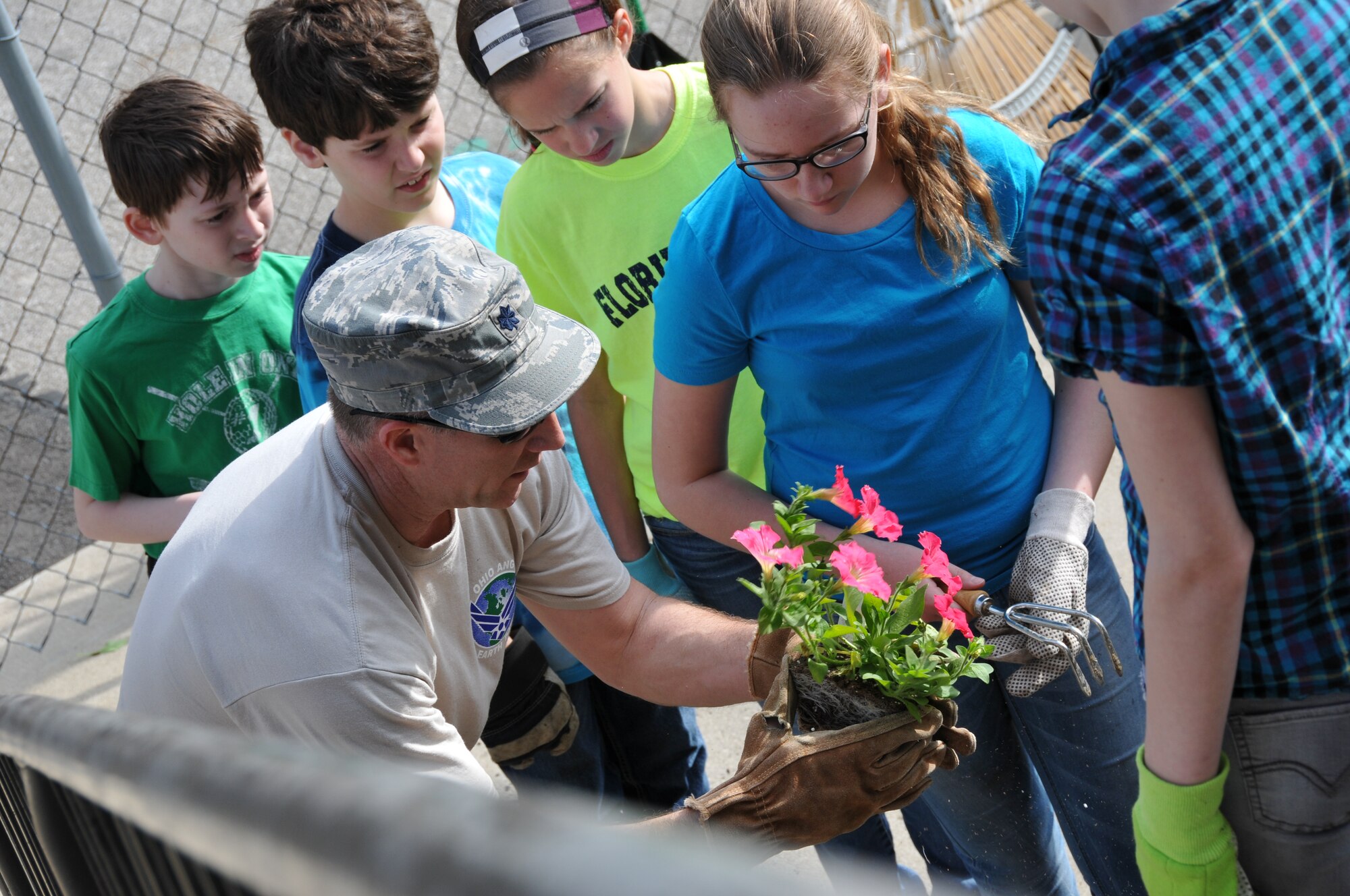 Members of the 179th Airlift Wing and 200th RED HORSE Detachment 1, team up to tackle Earth Day projects around Mansfield, OH, May 8,2014. The 179th has participated in Earth Day events for the past 15 years, with the 200th joining them for the last four years. The members are working with local schools and the North End Community Improvement Collaborative to help clean up Mansfield this spring. (U.S. Air National Guard Photo by TSgt Joseph Harwood \Released)