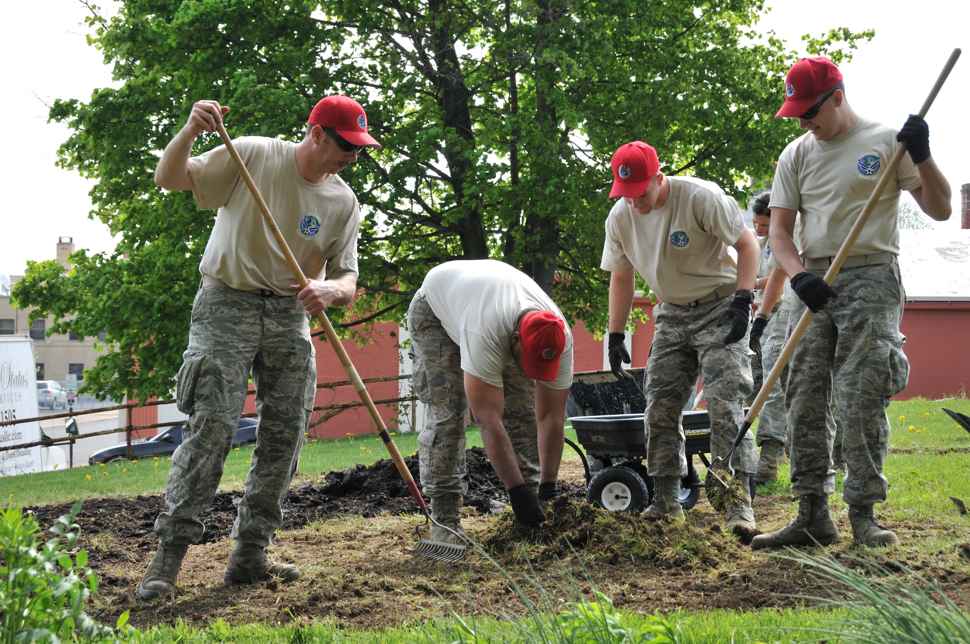 Members of the 179th Airlift Wing and 200th RED HORSE Detachment 1, team up to tackle Earth Day projects around Mansfield, OH, May 8,2014. The 179th has participated in Earth Day events for the past 15 years, with the 200th joining them for the last four years. The members are working with local schools and the North End Community Improvement Collaborative to help clean up Mansfield this spring. (U.S. Air National Guard Photo by TSgt Joseph Harwood \Released)