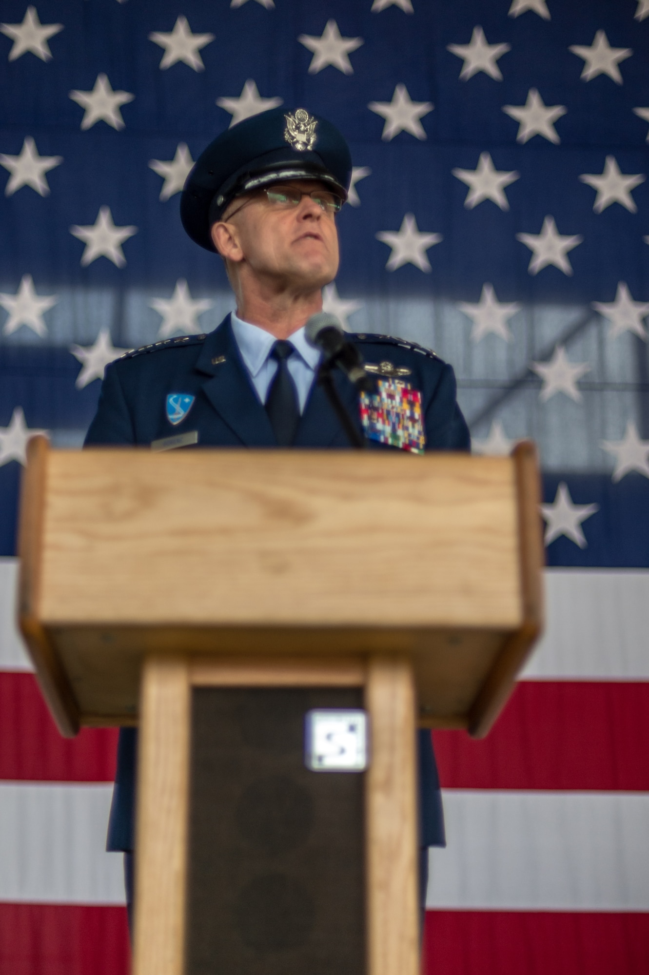 Gen. Frank Gorenc, U.S. Air Forces in Europe and Air Force Africa commander, speaks about the new 3rd Air Force commander, Lt. Gen. Darryl Roberson, and his accomplishments during the 3rd Air Force assumption of command ceremony June 11, 2014, Ramstein Air Base, Germany. Roberson comes to 3rd Air Force from his previous assignment as the vice director of operations on the joint staff in Washington, D.C. The command provides full-spectrum Air Force war-fighting capabilities throughout an area of responsibility that spans three continents and encompasses 104 countries. (U.S. Air Force photo/ Airman 1st Class Jordan Castelan)