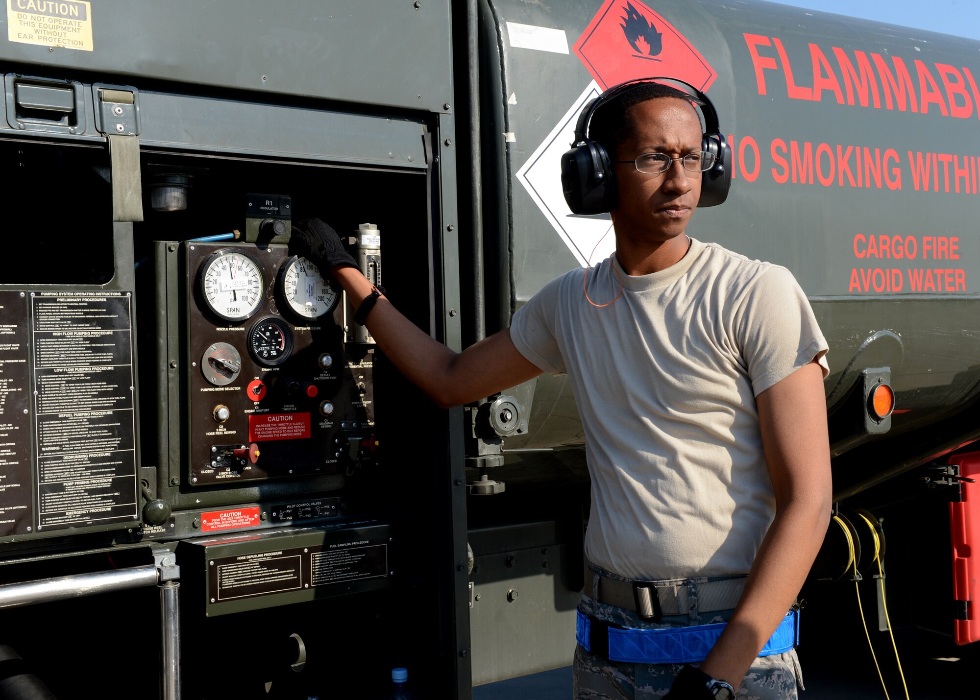 U.S. Air Force Staff Sgt. Jemarco Brooks, 52nd Logistics Readiness Squadron fuels distribution operator, Spangdahlem Air Base, Germany, pumps fuel into a U.S. Air Force F-16 Fighting Falcon fighter aircraft at Lask Air Base, Poland, June 9, 2014. There are four Polish Air Force Oshkosh R-11 fuel trucks at Lask Air Base that support refueling operations for U.S. and Polish aircraft participating in Exercise EAGLE TALON, BALTOPS 14 and U.S. Aviation Detachment Rotation 14-3 activities. This is the first time hot pit refueling has been done in Poland by U.S. Forces. (U.S. Air Force photo by Airman 1st Class Kyle Gese/Released)