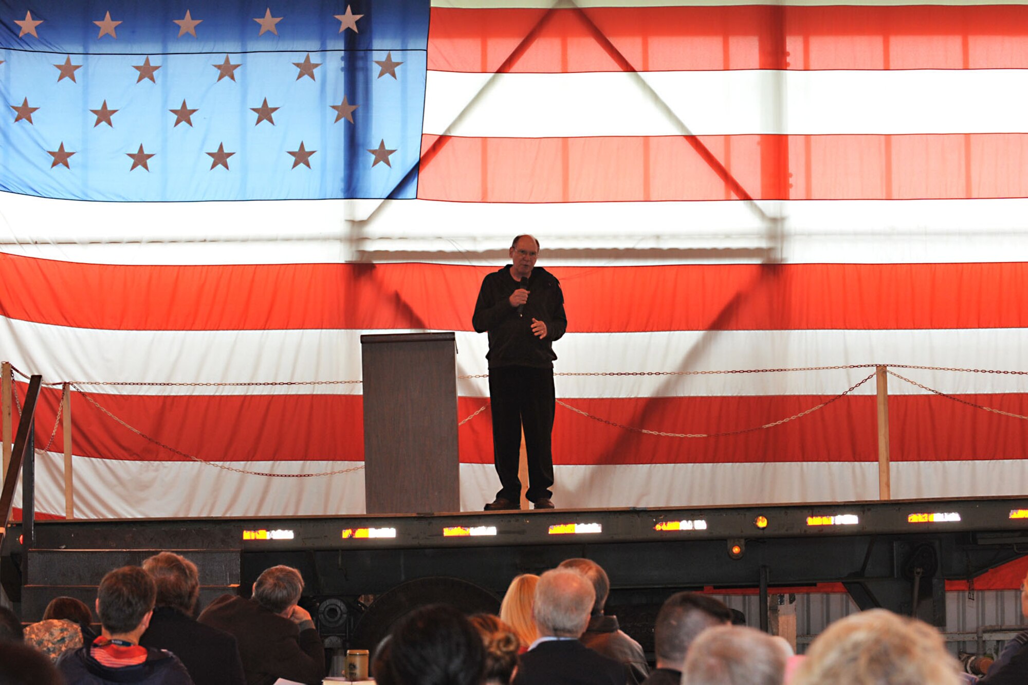 Dr. Robert J. Wicks, psychologist, motivational speaker and author, speak to Service members, Department of Defense contractors, civilians and dependents about bouncing back through darkness during Resiliency Day in hangar 92 at RAF Molesworth, United Kingdom May 30, 2014. The former U.S. Marine Corps Capt. has spent 35 years delivering his message of coping through life and becoming stronger to audiences such as military personnel, government officials and workers in medical practice. (U.S. Air Force photo by Staff Sgt. Ashley Hawkins/Released)