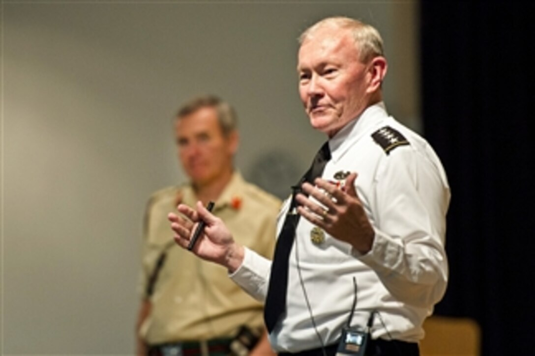 U.S. Army Gen. Martin E. Dempsey, chairman of the Joint Chiefs of Staff, speaks to students at the Defense Academy of the United Kingdom during a question-and-answer session with British Gen. Nickolas Houghton, chief of Britain's defense staff, in Shrivenham, England, June 11, 2014.