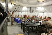 Major Jerry Willingham, current operations officer, Command Element, Marine Forces Central Command Forward, briefs members of Exercise Eager Lion 2014, Coalition Forces Land Component Staff on June 1, 2014. Eager Lion is a recurring, multinational exercise designed to strengthen military-to-military relationships, increase interoperability between partner nations and enhance regional security and stability. (U.S. Marine Corps photo by Master Sgt. William Price/Released)


