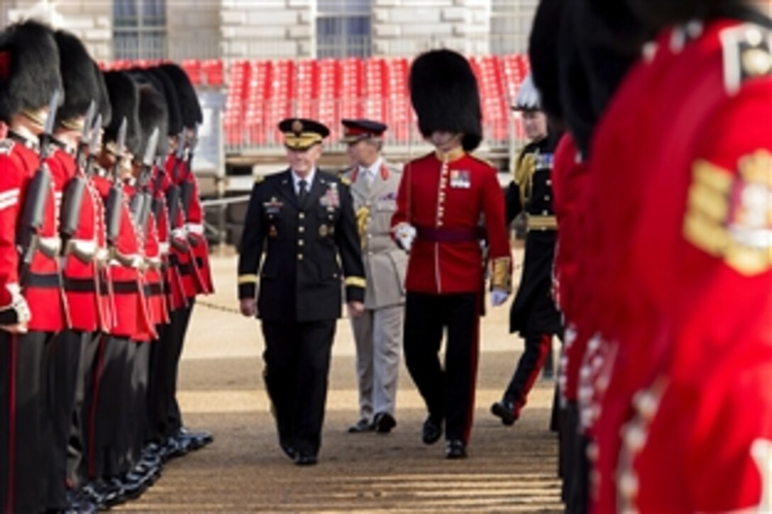 U.S. Army Gen. Martin E. Dempsey, left, chairman of the Joint Chiefs of Staff, inspects troops with British Gen. Sir Nicholas Houghton, chief of Britain's defense staff, during an honor guard ceremony to kick off a meeting of U.S. and British defense counterparts in London, June 10, 2014.