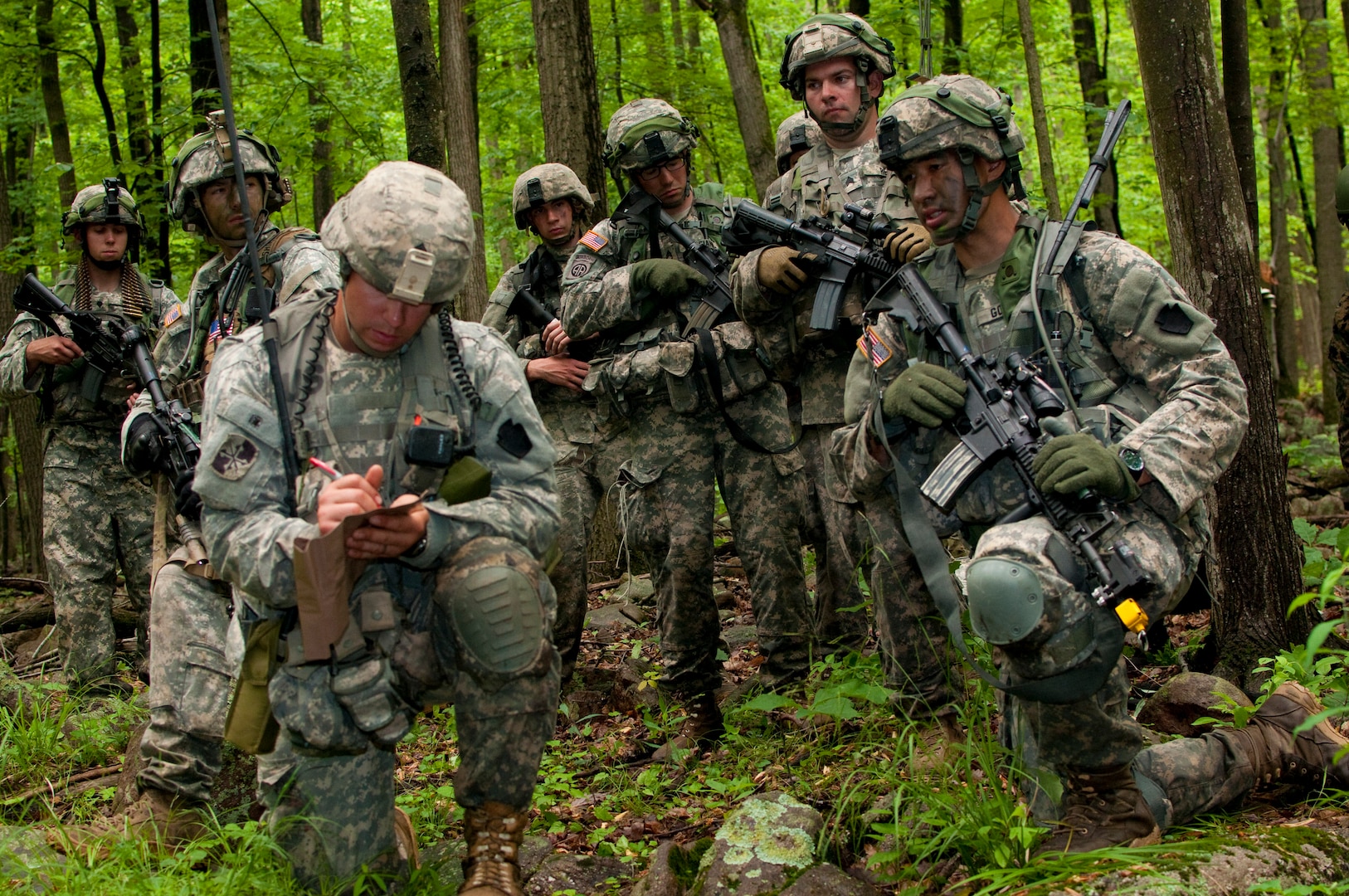 Army 2nd Lt. Abram Gordon, right, rifle platoon leader, Charlie Company, 1st Battalion, 175th Infantry Regiment, goes over his platoon movement plan during a field training exercise as part of annual training at Fort Indiantown Gap, Pa., June 9, 2014. Throughout the annual training period, Soldiers from 1st Battalion, 175th Infantry Regiment - a unit of the Maryland Army National Guard - have also worked alongside their counterparts from the Armed Forces of Bosnia-Herzegovina as part of the National Guard's State Partnership Program. The Maryland National Guard has been partnered with Bosnia-Herzegovina since 2003. 