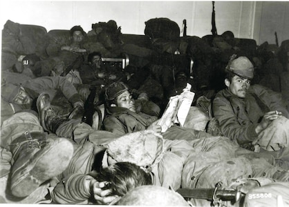 65th Infantry Regiment Soldiers spend Christmas aboard a ship; they were the last Army troops that evacuated out of Hungnam, North Korea after the surge of Chinese Communist forces pushed back U.S. forces that had earlier advanced northward in the Korean Peninsula.