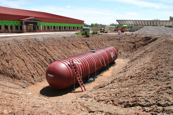 The 30 thousand gallon rainwater collection tank at the Reception Complex under construction at Fort Sill.