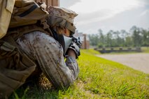 A Marine with Alpha Company, 8th Engineer Support Battalion, 2nd Marine Logistics Group scans the area for oppositional forces during a Military Operations in Urban Terrain exercise aboard Camp Lejeune, N.C., June 5, 2014. The company used the Special Effects Small Arms Marking System during the training to provide Marines with simulated ammunition during firefights in an effort to increase the realism of the exercise.