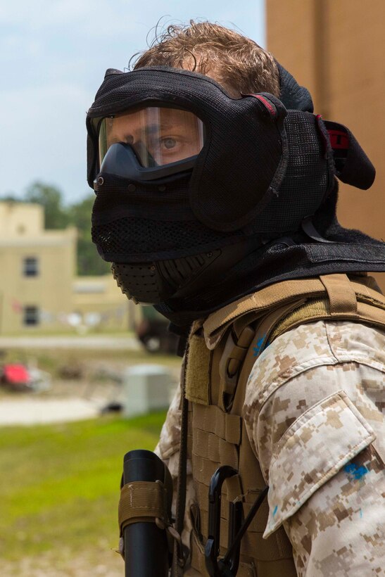 A Marine with Alpha Company, 8th Engineer Support Battalion, 2nd Marine Logistics Group scans the area for oppositional forces during a Military Operations in Urban Terrain exercise aboard Camp Lejeune, N.C., June 5, 2014. The company used the Special Effects Small Arms Marking System during the training to provide Marines with simulated ammunition during firefights in an effort to increase the realism of the exercise.