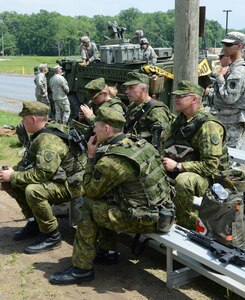 Pennsylvania National Guard soldiers from the 28th Infantry Division train on advanced rifle marksmanship techniques with Lithuanian infantrymen and women at Fort Indiantown Gap, Pa., June 10, 2014.