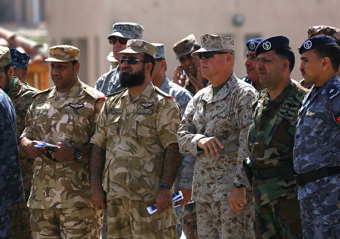 Lieutenant Gen. Robert B. Neller, commander, U.S. Marine Corps Forces Central Command, along with other general officers from five different continents, watch during a tour of the USNS 1st LT Baldomero Lopez, as a 60-ton M1 Abrams tank is lifted aboard the Maritime Pre-Positioning vessel, May 28, at the Port of Aqaba, in the Kingdom of Jordan, in support of Exercise Eager Lion 2014.  Eager Lion is a recurring, multinational exercise designed to strengthen military-to-military relationships, increase interoperability between partner nations and enhance regional security and stability.  (U.S. Marine Corps photo by Master Sgt. Will Price/Released)