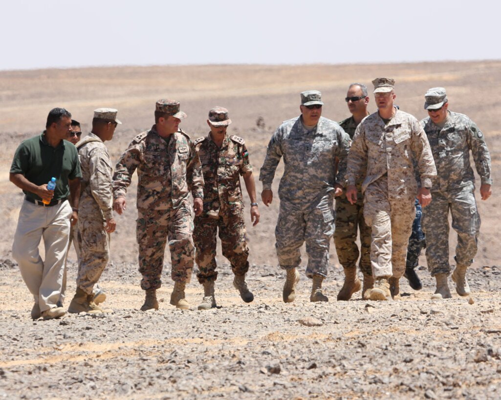 PETRA, Jordan (June 1, 2014) -- Brigadier Gen. Gregg Olson and Jordanian Armed Forces Brig. Gen.  Ali Al-Domi, Commanding General, 99th Armoured Brigade,  greet U.S. Army Maj. Gen. Robert Catalanotti, U.S. Central Command director of Exercises and Training Directorate, as he arrives to review a range in support of Eager Lion 2014 at a base near Petra, Jordan,  June 1 Eager Lion is a recurring, multinational exercise designed to strengthen military-to-military relationships, increase interoperability between partner nations and enhance regional security and stability.   (U.S. Marine Corps photo by; Sgt James A. Hall, CE MARFOR CENTCOM (FWD) Combat Camera/Released)