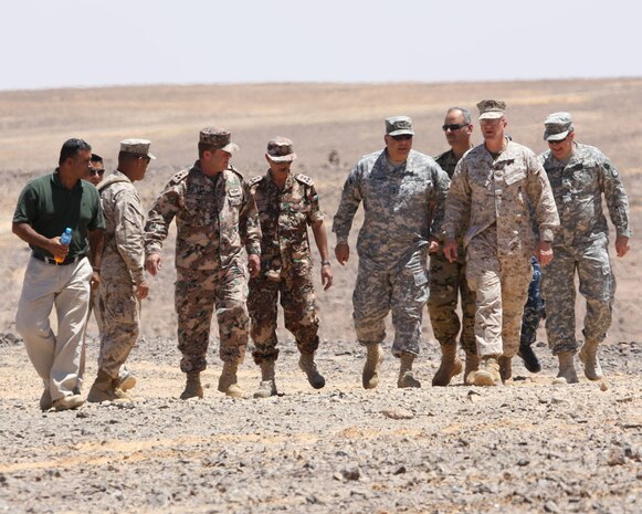 PETRA, Jordan (June 1, 2014) -- Brigadier Gen. Gregg Olson and Jordanian Armed Forces Brig. Gen.  Ali Al-Domi, Commanding General, 99th Armoured Brigade,  greet U.S. Army Maj. Gen. Robert Catalanotti, U.S. Central Command director of Exercises and Training Directorate, as he arrives to review a range in support of Eager Lion 2014 at a base near Petra, Jordan,  June 1 Eager Lion is a recurring, multinational exercise designed to strengthen military-to-military relationships, increase interoperability between partner nations and enhance regional security and stability.   (U.S. Marine Corps photo by; Sgt James A. Hall, CE MARFOR CENTCOM (FWD) Combat Camera/Released)