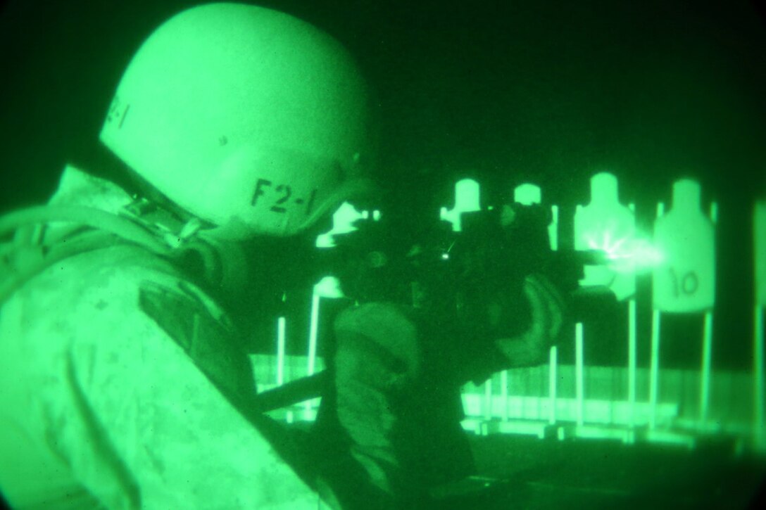 A Marine with the Force Reconnaissance Detachment, 11th Marine Expeditionary Unit, fires his M4 carbine during a close quarters tactics range on the flight deck of the USS San Diego as part of Certification Exercise (CERTEX), off the coast of Southern California, June 11, 2014. The 11th MEU and Amphibious Squadron 5 team conduct CERTEX to hone mission-essential tasks, execute specified MEU and Amphibious Ready Group operations, and certify the foundation of a cohesive warfighting team for exercises and operations they may encounter in their upcoming deployment. (U.S. Marine Corps photo by Cpl Jonathan R. Waldman/RELEASED)