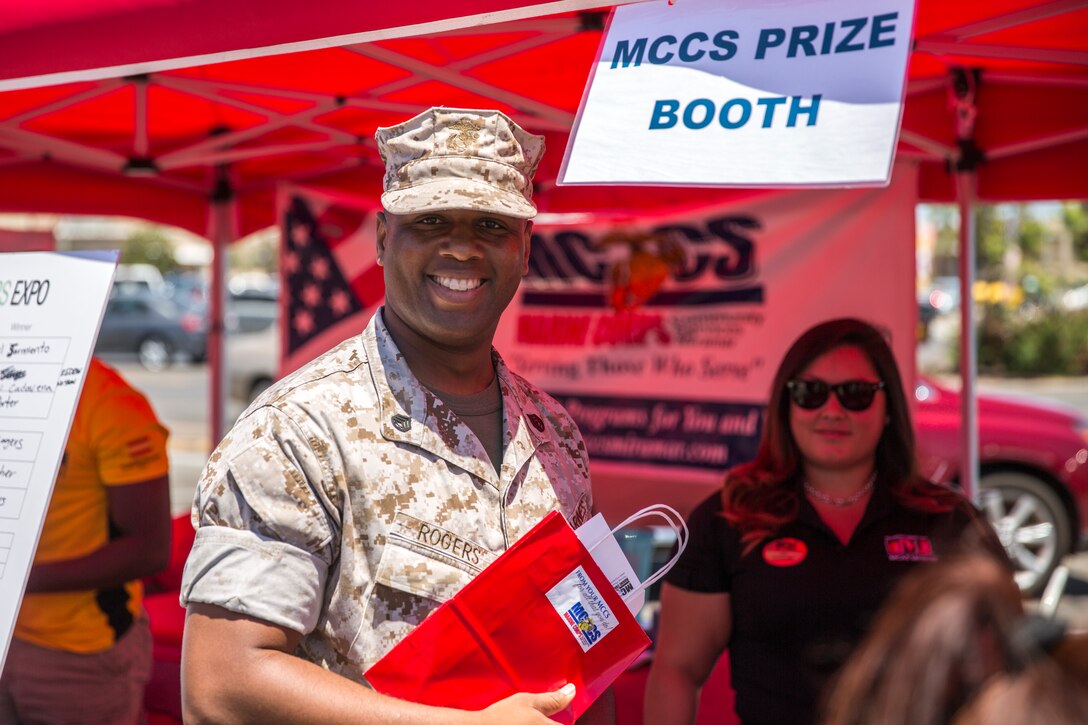 MARINE CORPS AIR STATION MIRAMAR, Calif. – Staff Sgt. Jonathan Rogers, data communications staff noncommissioned officer with Headquarters and Headquarters Squadron, wins a prize for two Davey’s Locker Whale Watching boarding passes at the Marine Corps Air Station Miramar Information Tickets and Tours Expo 2014, aboard Marine Corps Air Station Miramar, Calif., June 12. Prizes were awarded to raffle participants at the ITT Expo every 15 minutes. This is the first expo the air station has hosted in five years. 
