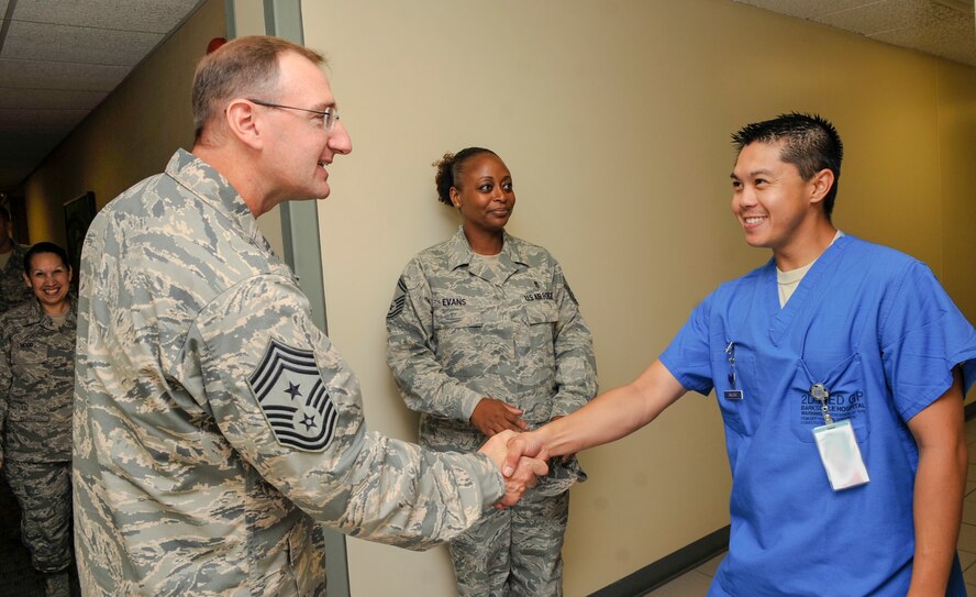 Chief Master Sgt. Marty Anderson, Eighth Air Force command chief, greets Staff Sgt. Christian Gallevo, 2nd Medical Support Squadron dental clinic dental assistant, during an immersion tour on Barksdale Air Force Base, La., June 11, 2014. The immersion tour allowed Anderson to meet with Airmen of the 2nd Bomb Wing in order to answer questions and to receive feedback from the Airmen. (U.S. Air Force photo/Airman 1st Class Benjamin Raughton)  