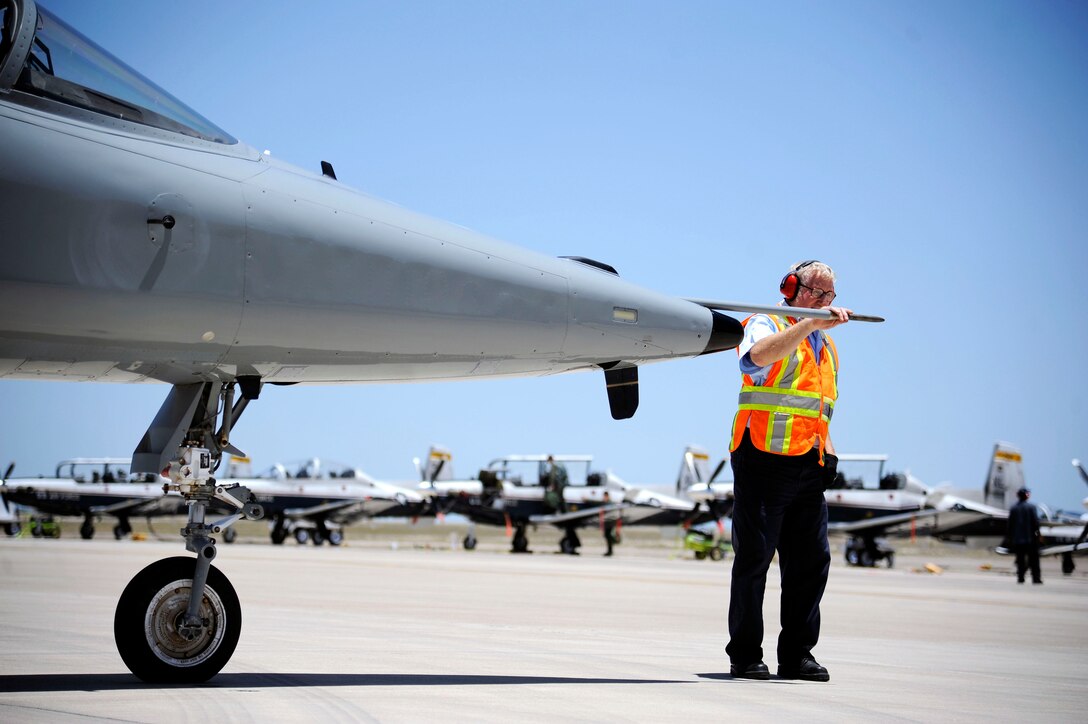 Clive Trammell, 47th Maintenance Directorate contract manager, conducts a final inspection of the pitot static tube of an AT-38B Talon on Laughlin Air Force Base, Texas, June 10, 2014. A pitot tube, on an aircraft, is a device that measures ram air pressure and is used to quantify airspeed. (U.S. Air Force photo by Staff Sgt. Steven R. Doty, 47th Flying Training Wing.)(Released)
