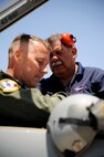 Robert Marques, 47th Maintenance Directorate aircraft servicer, assists Lt. Col. Ripley Woodard, 415th Flight Test Flight commander and test pilot, with his harness at Laughlin Air Force Base, Texas, June 10, 2014. Woodard, a nine year veteran with the 415th FLTF, was picking up the Holloman based AT-38B after delivering one of Laughlin’s own T-38’s following depot maintenance and major modifications by the 571st Aircraft Maintenance Squadron at Joint Base San Antonio-Randolph, Texas. (U.S. Air Force photo by Staff Sgt. Steven R. Doty, 47th Flying Training Wing.)(Released)