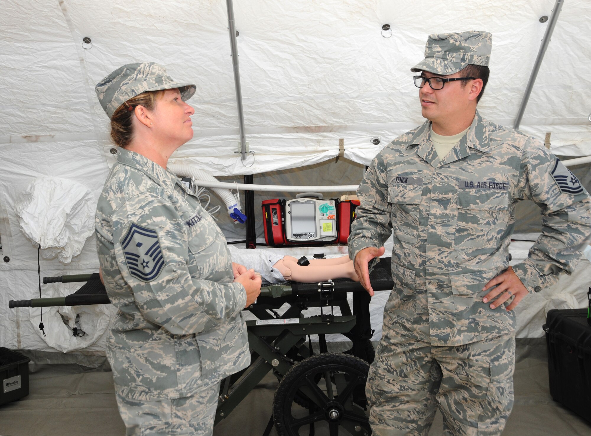 Senior Master Sgt. Lorene Kitzmiller, the First Sgt. for 1st Air Force, left, discusses some of the procedures and training that Airmen of the CBRNE Enhanced Response Force Packages (CERFP) take on as first responders, during a tour of the Portland Air National Guard Base, Ore., June 10, 2014. (Air National Guard photo by Tech. Sgt. John Hughel, 142nd Fighter Wing Public Affairs/Released)
