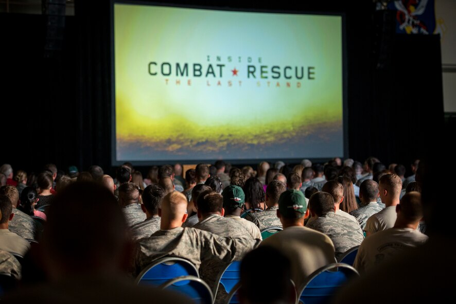Airmen and their families watch the world premiere of National Geographic Channel’s “Inside Combat Rescue: The Last Stand” at Moody Air Force Base, Ga., June 11, 2014. The special featured Moody Airmen from the 822d Base Defense Squadron during their latest deployment where they were assigned to Reaper teams of the 755th Expeditionary Security Forces Squadron.  (U.S. Air Force photo by Airman 1st Class Ryan Callaghan/Released)