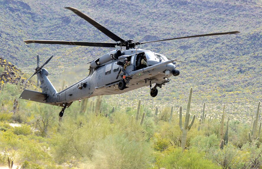 DAVIS-MONTHAN AIR FORCE BASE, Ariz. –Air Force special mission aviation Airman assigned to the Air 305th Rescue Squadron, prepares shoots the .50-caliber machine gun onboard a HH-60G Pave Hawk helicopter during a training mission March 4. The 305th RQS is assigned to the 943rd Rescue Group, which is assigned to the 920th Rescue Wing, Patrick AFB, Fla. The 943rd RQG trains and equips Citizen Airmen to perform personnel recovery operations worldwide. (U.S. Air Force photo/Tech. Sgt. Frank Oliver) 

