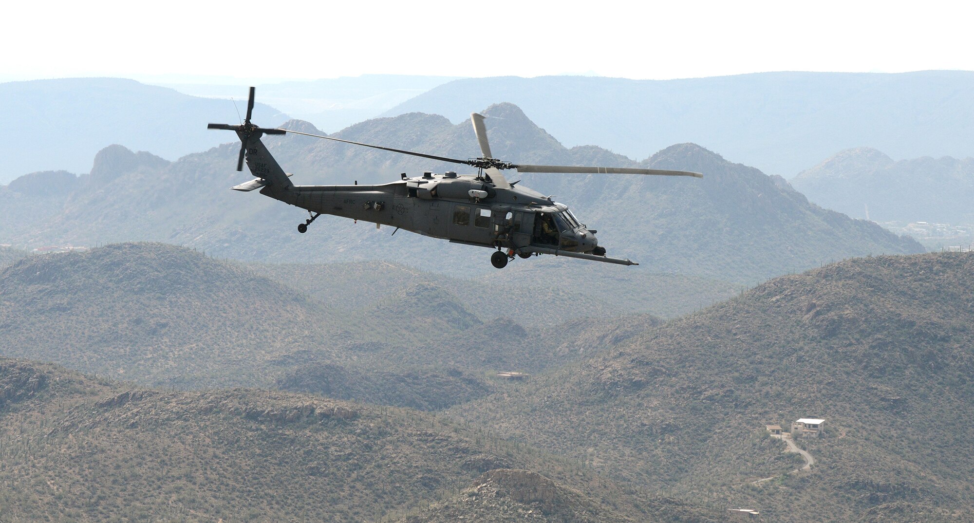 DAVIS-MONTHAN AIR FORCE BASE, Ariz. – A 305th Rescue Squadron HH-60G Pave Hawk helicopter flies across the Southern Arizona desert during a training mission March 4.  The 305th RQS is assigned to the 943rd Rescue Group, which is assigned to the 920th Rescue Wing, Patrick AFB, Fla. The 943rd RQG trains and equips Citizen Airmen to perform personnel recovery operations worldwide. (U.S. Air Force photo/Tech. Sgt. Frank Oliver)