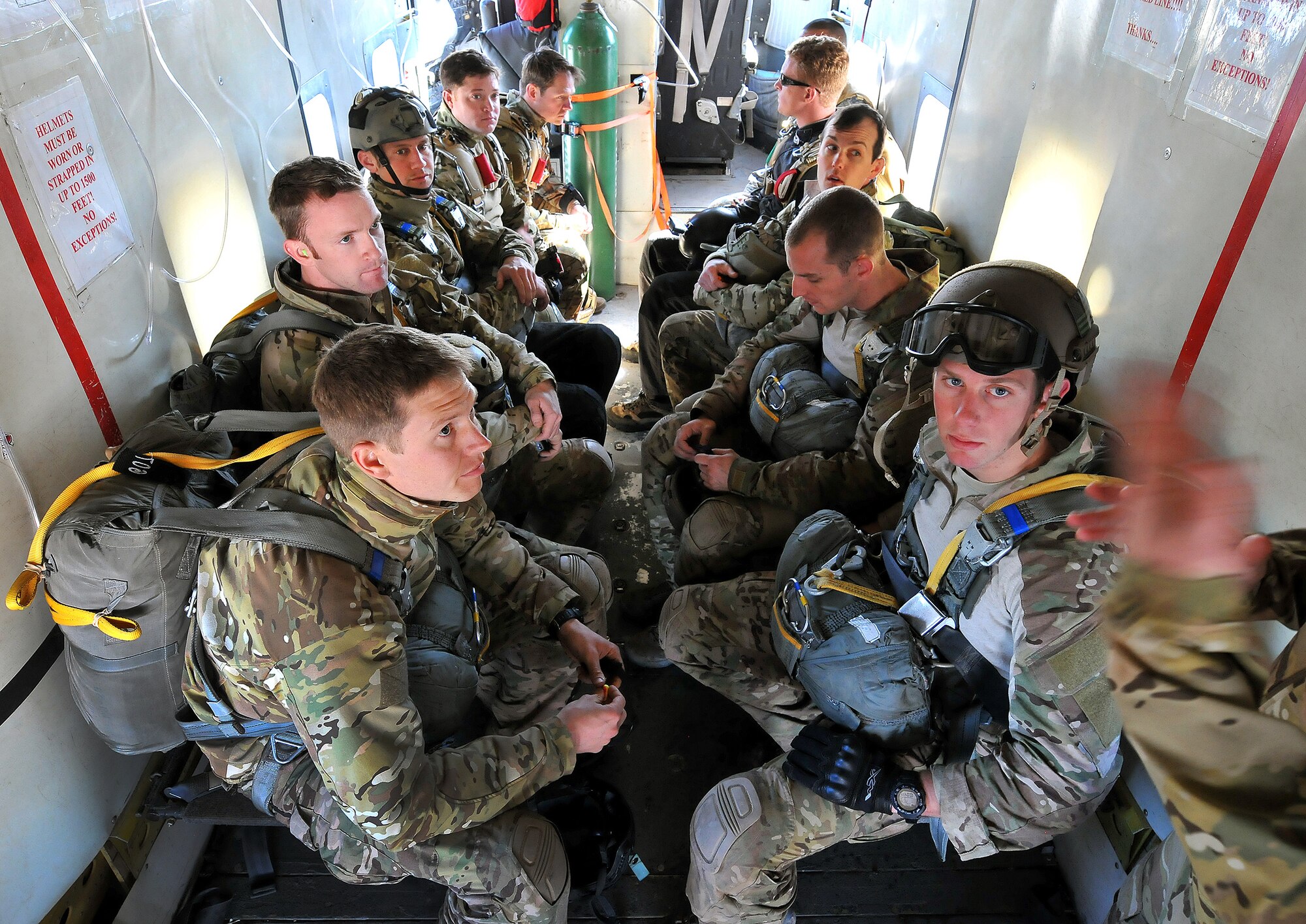 DAVIS-MONTHAN AIR FORCE BASE, Ariz. – Pararecuemen (PJs) assigned to the 306th Rescue Squadron receive last minute instructions as they prepare to parachute out of a skydiving aircraft over the Eloy, Arizona skies during a training mission March 2. PJs are specifically organized, trained and equipped to conduct personnel recovery operations in hostile or denied areas as a primary mission. The 306th RQS is a subordinate unit of the 943rd Rescue Group, which trains and equips Citizen Airmen to perform personnel recovery operations worldwide. (U.S. Air Force photo/Tech. Sgt. Frank Oliver)