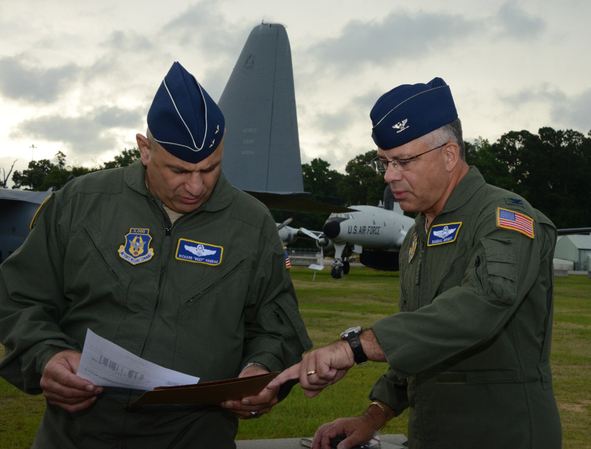 Maj. Gen. Richard S. Haddad, left, vice commander of Air Force Reserve Command, and Col. Randall Bright, chief of plans in the AFRC Directorate of Plans and Program, review the orders that directed them into combat over the “Highway of Death” during Desert Storm.  (U.S. Air Force photo/Master Sgt. Chance Babin)