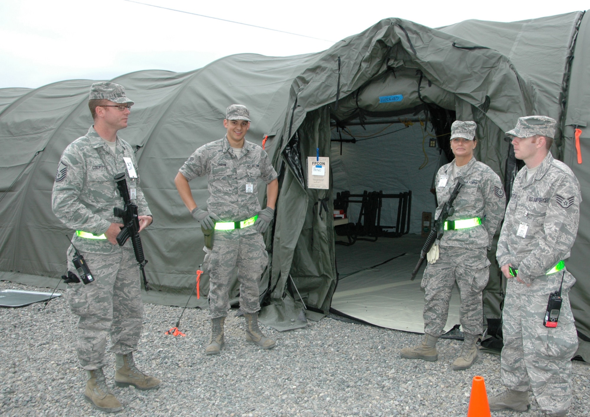 From left to right, providing security at the En Route Patient Staging Facility during the Rainier Medic course are Master Sgt. Sean Colpitts, 446th Aeromedical Staging Squadron, Senior Airman Jacob Garvin, 302nd ASTS, Peterson Air Force Base, Colorado, Tech Sgt. Tanya Donelson, and Staff Sgt. John Hoffmeister, both with the 145th Medical Group, Charlotte, North Carolina. (U.S. Air Force Reserve photo by Sandra Pishner)