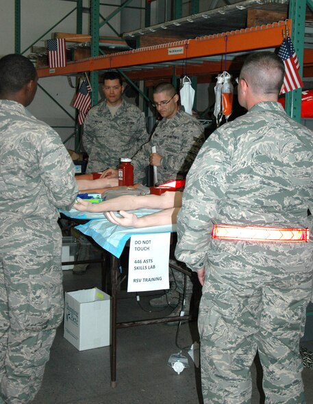 Senior Airman Kyle Bosshart, 446th Aeromedical Staging Squadron, conducts skills training for Airmen participating in the Rainer Medic course June 3 at Joint Base Lewis-McChord, Washington.  (U.S. Air Force Reserve photo by Sandra Pishner)