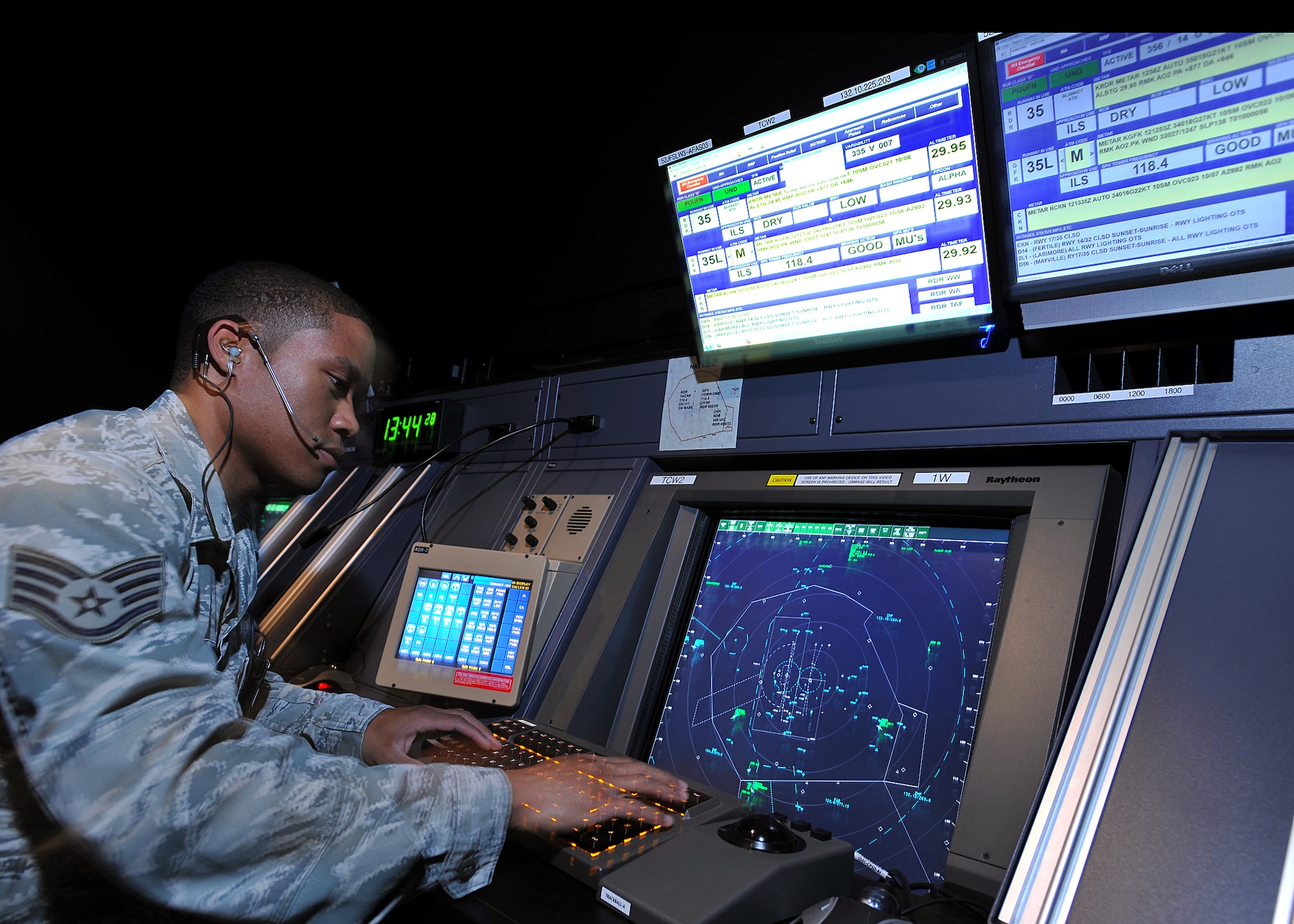 Staff Sgt. Obed Salazar, 319th Operations Support Squadron air traffic controller, oversees multiple aircraft in the Radar Approach Control tower on Grand Forks Air Force Base, N.D., June 12, 2014. Salazar, a native of Clarksville, Tenn., was named Warrior of the Week for the second week of June 2014. (U.S. Air Force photo/Senior Airman Xavier Navarro)