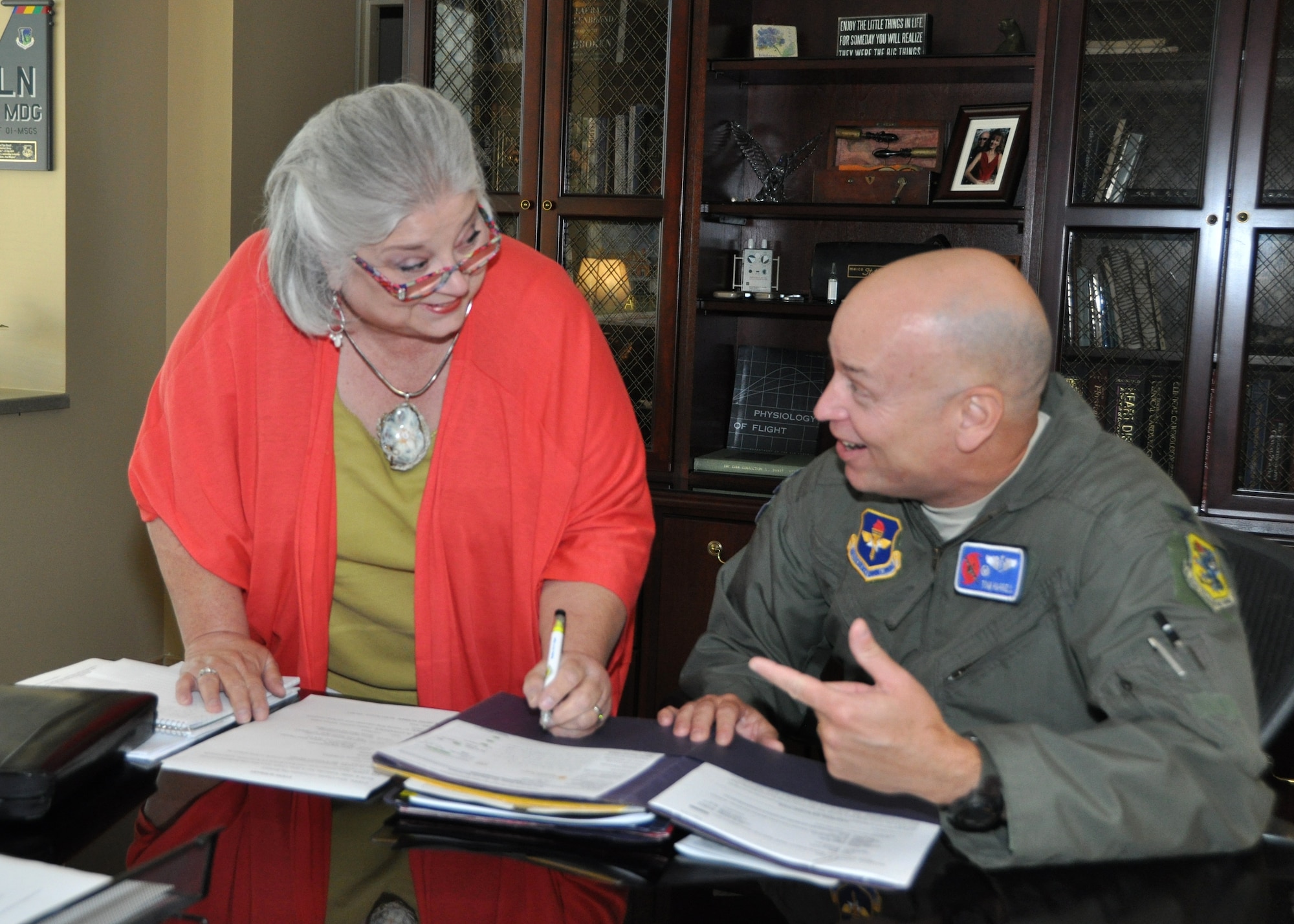 Kay Hymel, executive assistant to the 81st Medical Group commander, assists
current commander Col. (Dr.) Tom Harrell as he reviews folders in his office
June 4.  "Miss Kay" will be honored during a June 12 retirement ceremony in
Keesler Medical Center's Don Wylie Auditorium as she completes almost 30
years of federal service.  Retired Lt. Gen. Clark Griffith, former Air
Education and Training Command vice commander, will officiate. (U.S. Air Force photo by Steve Pivnick) 
