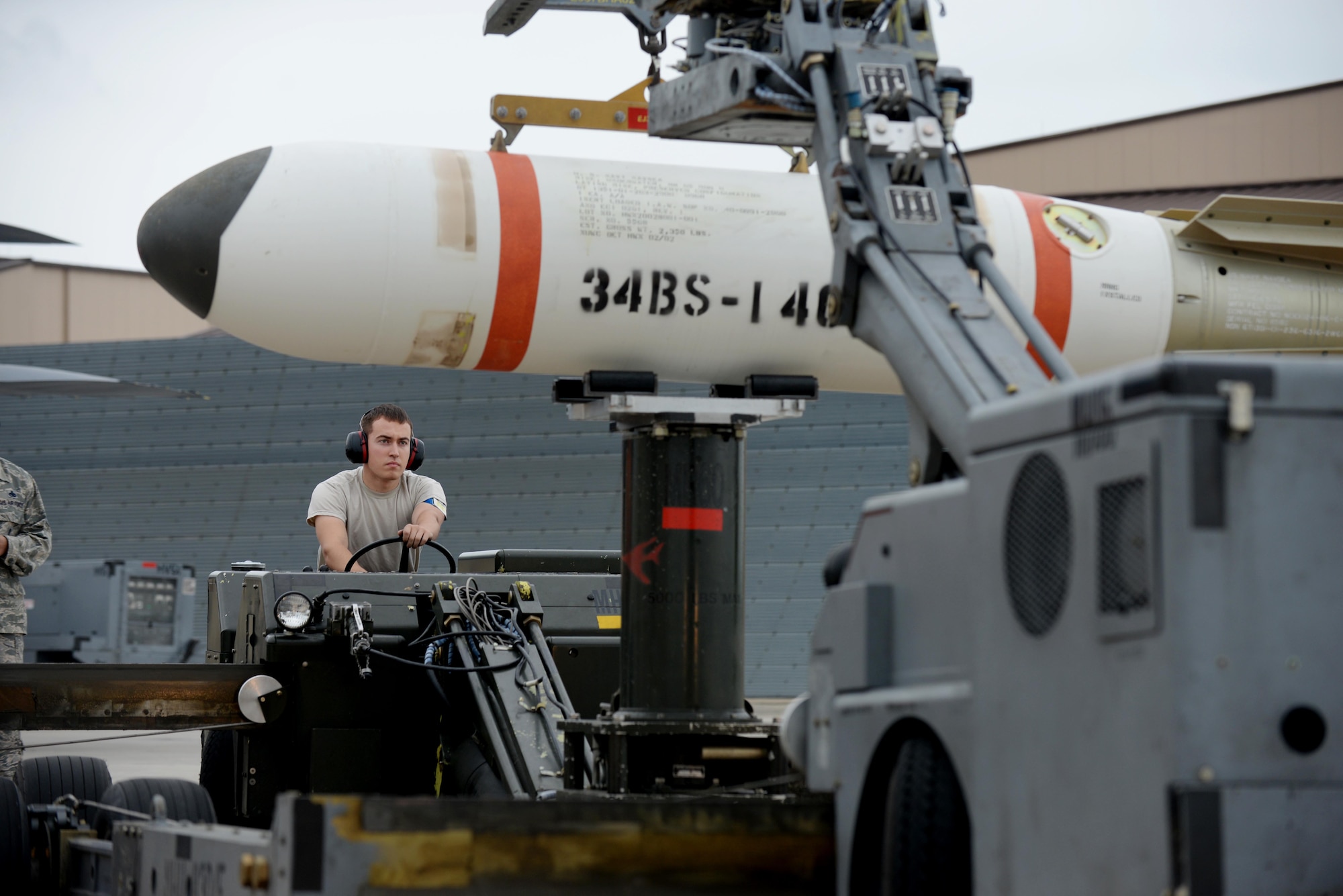 Airman 1st Class Trenton Anderson, 28th Munitions Squadron load crew member, transfers an Mk-65 Quick Strike mine onto a jammer prior to loading into a B-1 bomber during a joint mission exercise at Ellsworth Air Force Base, S.D., June 3, 2014. The B-1 and B-52 Stratofortress are the only aircraft capable of delivering the Mk-65 and 62 payloads. (U.S. Air Force photo by Airman 1st Class Rebecca Imwalle/Released)