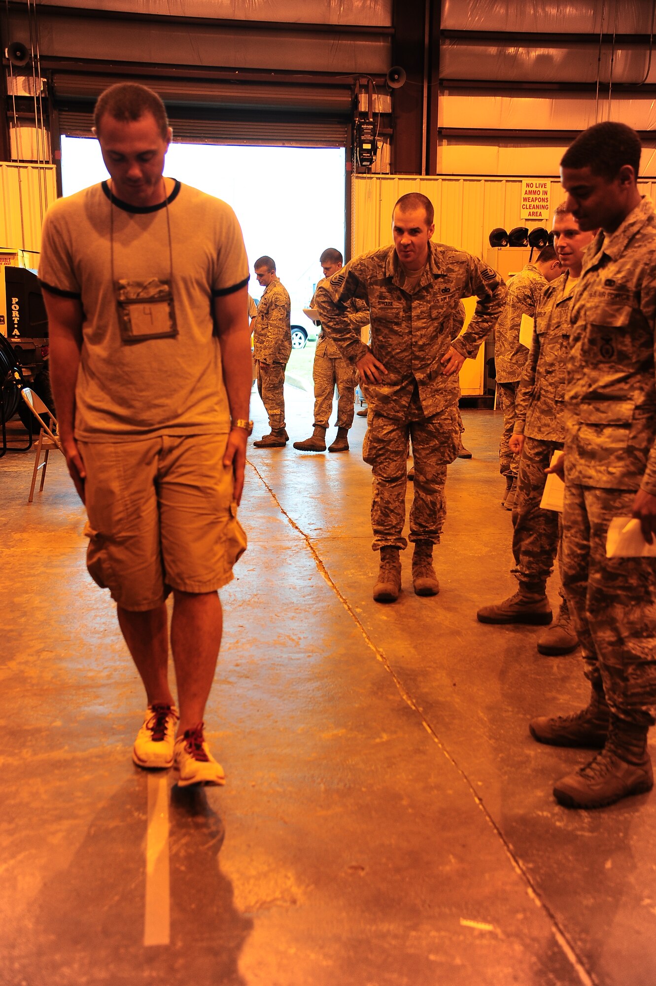 Airmen are evaluated on their performance while conducting hands-on Field Sobriety Test training on June 11 at the Columbus Air Force Base Security Forces Warehouse. Also participating in the training was the Starkville Police Department.  The two agencies used the training to promote public safety and teach tactics to use in detecting intoxicated drivers. (U.S. Air Force Photo/Airman 1st Class Daniel Lile)