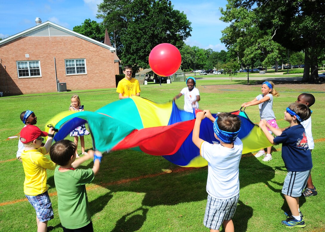 Children play outside during Vacation Bible School which was held June 2-6 at the Base Chapel. The theme for this year’s VBS was “Wilderness Escape” and over 75 children attended the event. (U.S. Air Force Photo/Senior Airman Kaleb Snay)