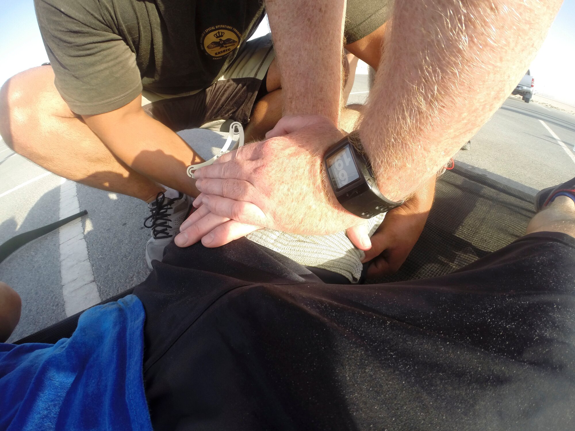 Pedro 66 Memorial Challenge participants apply pressure to a simulated wound at Al Udeid Air Base, Qatar, June 8, 2014. The event tested the teams’ mental and physical ability with the main component being about teamwork. (U.S. Air Force photo by Tech. Sgt. Trevor Pedro)