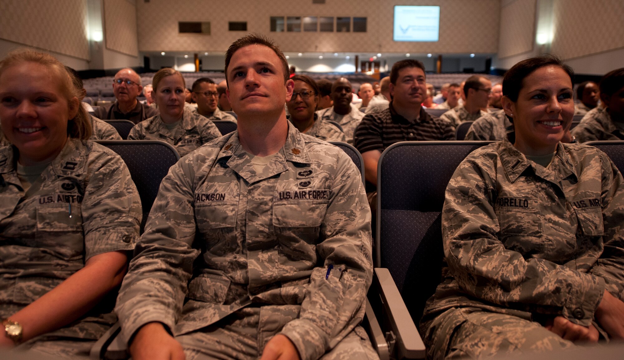 Members of the 42nd Air Base Wing, wing staff agency wait to begin the Sexual Assault Prevention and Response down-day at Maxwell Air Force Base, June 11, 2014. The SAPR down-day began with a briefing from Col. Mark Ramsey, 42nd ABW vice commander, on identifying the perpetrators of sexual assault, and is intended to help prevent sexual assault in the military by helping service members understand and learn how to combat the issue. (U.S. Air Force photo by Staff Sgt. Gregory Brook) 