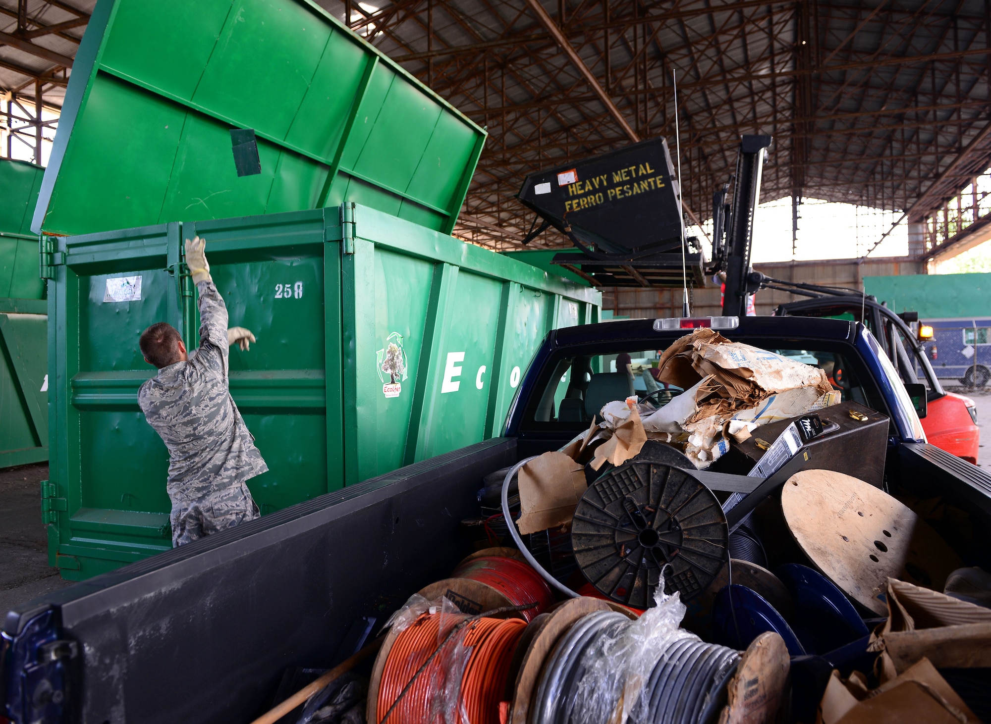 Staff Sgt. Paul Dakins, Detachment 8, American Forces Network, disposes of a piece of metal during a base-wide spring cleaning event, May 30, 2014, at Aviano Air Base, Italy. The event was a first for Aviano’s Defense Logistics Agency Disposition Services office, which overseas proper removal unused government property. (U.S. Air Force photo/Senior Airman Matthew Lotz)