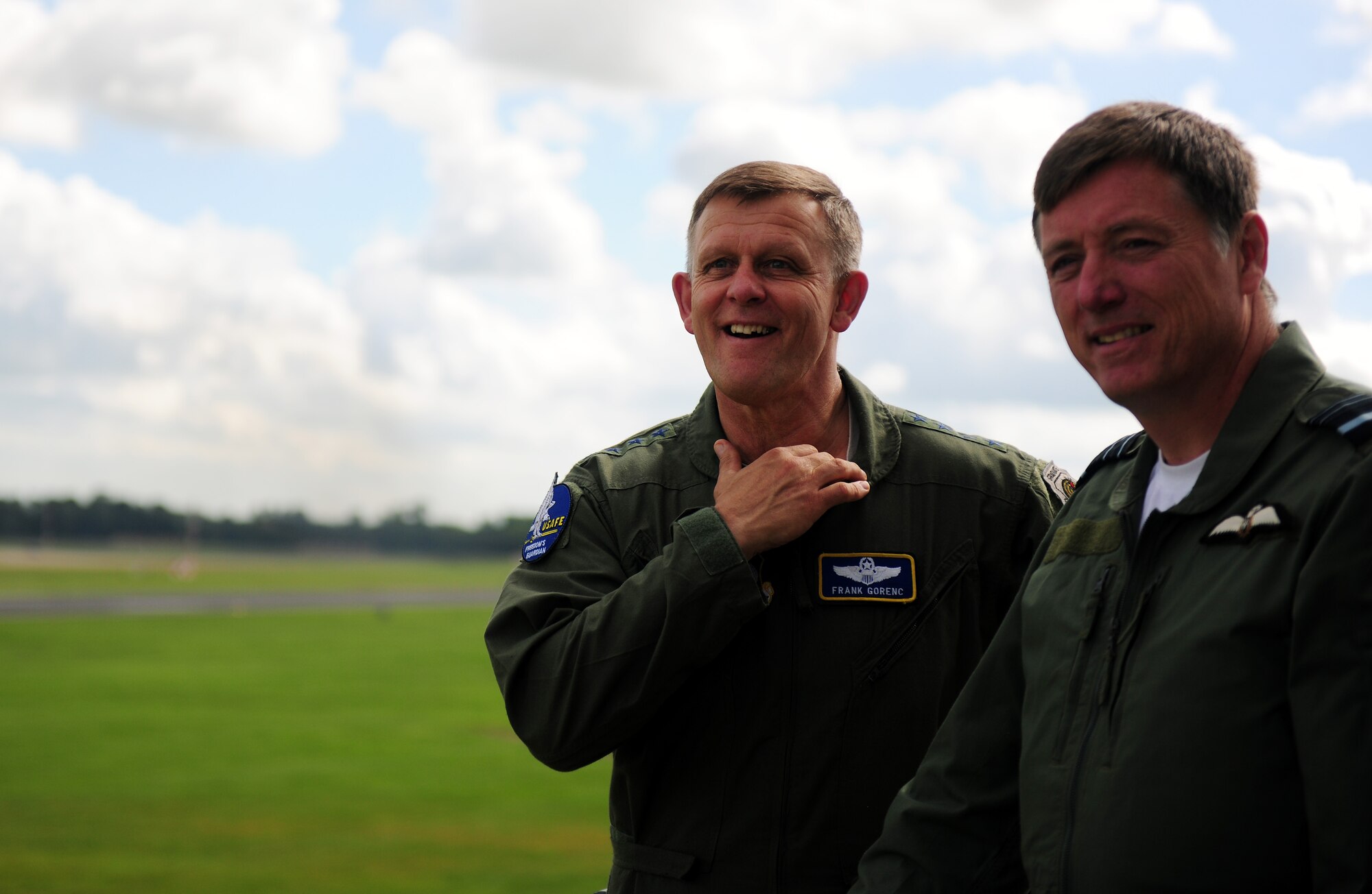 U.S. Air Force Gen. Frank Gorenc, U.S. Air Forces in Europe, U.S. Air Forces Africa and Allied Air Command commander, left, and Royal Air Force Air Marshal Greg Bagwell, Air Command operations deputy commander, watch a B-52 Stratofortress take off from RAF Fairford, United Kingdom, June 10, 2014. The B-52, deployed from Barksdale Air Force Base, La., is one of several airframes that conducted training operations from RAF Fairford throughout the U.S. European Command area of responsibility. (U.S. Air Force photo by Staff Sgt. Jarad A. Denton/Released)