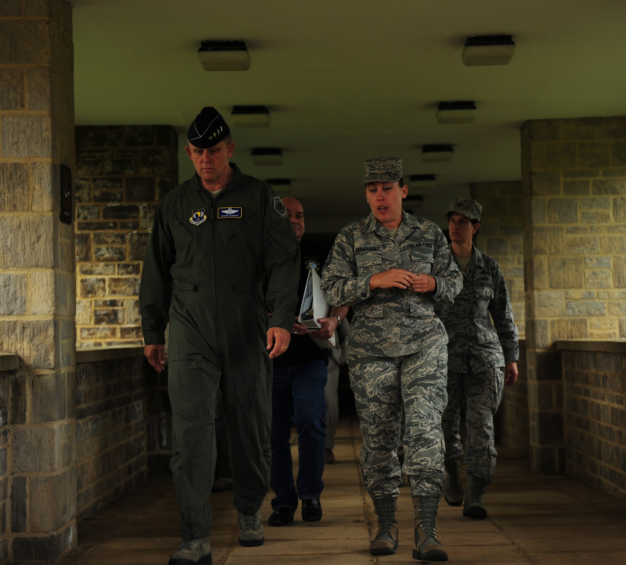 Master Sgt. Christina Hernandez, 2nd Aircraft Maintenance Squadron first sergeant, right, discusses short-term deployment living conditions with Gen. Frank Gorenc, U.S. Air Forces in Europe and U.S. Air Forces Africa commander, outside a contingency lodging facility at RAF Fairford, United Kingdom, June 10, 2014. Hernandez, and Airmen from multiple wings, deployed to the United Kingdom to conduct training operations with United States and allied military forces throughout the region. (U.S. Air Force photo by Staff Sgt. Jarad A. Denton/Released)