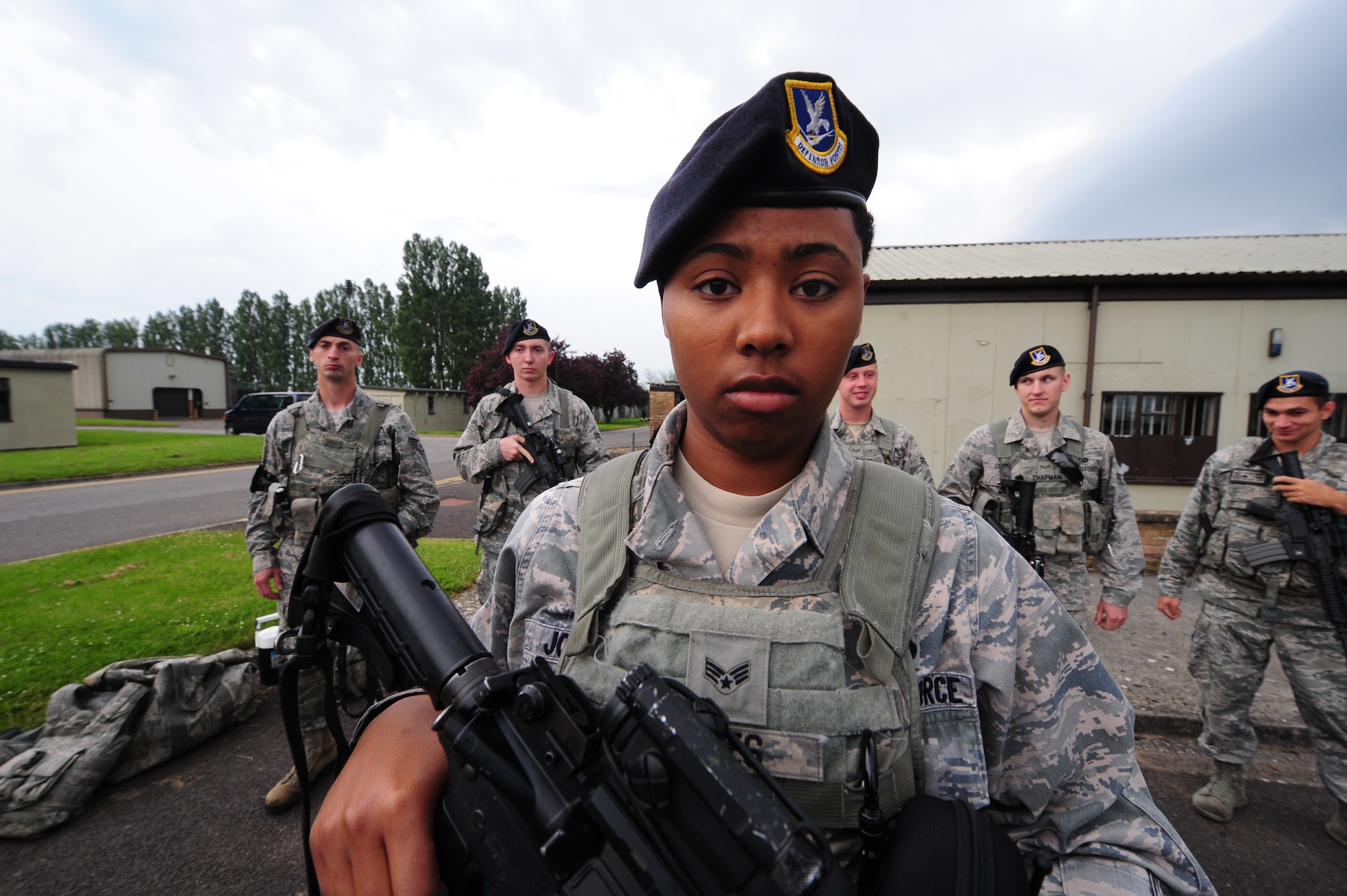 Senior Airman Whitney Jones, 509th Security Forces Squadron, Whiteman Air Force Base, Missouri, stands with her fellow Defenders during a roll call at RAF Fairford, England. Her hometown is Louisville, Kentucky and she has served in the Air Force for nearly three years. (U.S. Air Force photo by Staff Sgt. Nick Wilson/Released)