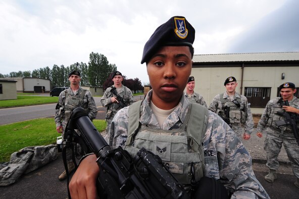 Senior Airman Whitney Jones, 509th Security Forces Squadron, Whiteman Air Force Base, Missouri, stands with her fellow Defenders during a roll call at RAF Fairford, England. Her hometown is Louisville, Kentucky and she has served in the Air Force for nearly three years. (U.S. Air Force photo by Staff Sgt. Nick Wilson/Released)