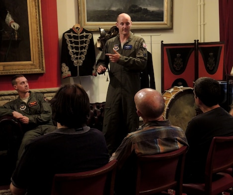 Royal Air Force Flight Lieutenant Ian Hart, GR4 Tornado pilot, speaks with members of the Cirencester Air Group during a group meeting June 9, 2014 in Swindon, England. Hart, along with fellow B-2 and B-52 pilots, spoke about their training and experiences as Air Force pilots. Hart is currently participating in a specialized United Kingdom-United States exchange program, where he is assigned to the 13th Bomb Squadron, Whiteman Air Force Base, Missouri and accomplishes training alongside American B-2 pilots. (U.S. Air Force photo by Candy Knight/Released)
