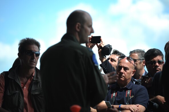 Royal Air Force Flight Lieutenant Ian Hart, GR4 Tornado pilot, speaks with media members during a media day at RAF Fairford, England June 10, 2014. Hart is currently participating in a specialized United Kingdom-United States exchange program, where he is assigned to the 13th Bomb Squadron, Whiteman Air Force Base, Missouri and accomplishes training alongside American B-2 pilots. He is mission-qualified to pilot a B-2 Spirit. (U.S. Air Force photo by Staff Sgt. Nick Wilson/Released)