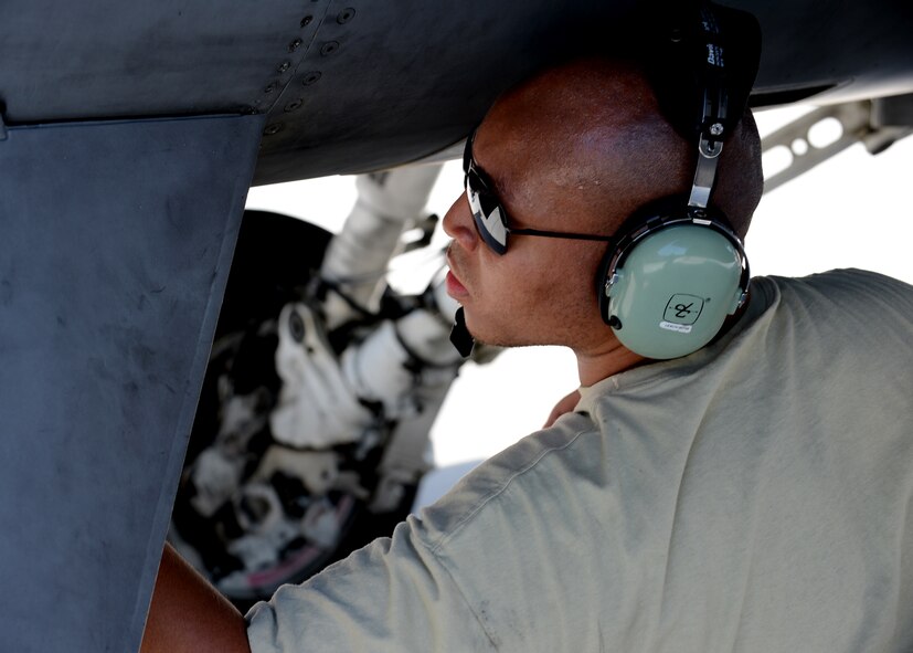 U.S. Air Force Staff Sgt. Samuel Leach Jr., 52nd Equipment Maintenance Squadron F-16 Fighting Falcon phase inspector from Pittsburgh, prepares an aircraft for flight at Lask Air Base, Poland, June 9, 2014. There are 18 aircraft participating in Polish-led combined Exercise EAGLE TALON and BALTOPS 14 during the U.S. Aviation Detachment Rotation 14-3 in Poland. U.S. Air Force pilots flew with other pilots from multiple countries as wingmen to increase readiness for real-world operations and enhance interoperability between NATO forces. (U.S. Air Force photo by Airman 1st Class Kyle Gese/Released)