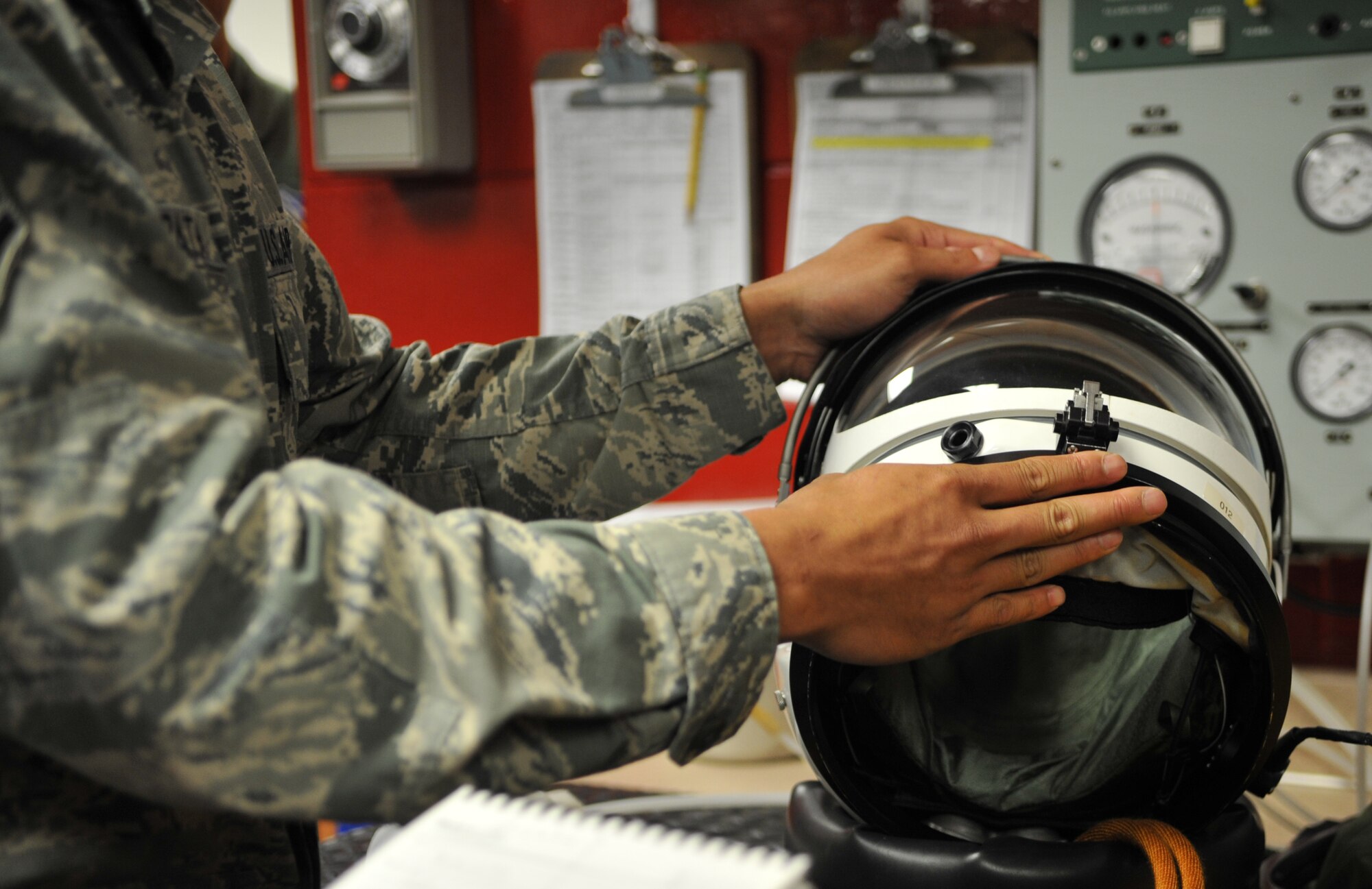 Staff Sgt. Jimmy Sayarath, 9th Physiological Support Squadron launch and recovery technician, Beale Air Force Base, Calif., explains how the seal on a U-2 Dragon Lady pilot’s helmet works during an immersion tour with Republic of Korea air force Lt. Gen. Jae-Bock Park, ROK Air Force Operations Command commander, at Osan Air Base, ROK, June 11, 2014. Pilots have the ability to adjust the pressure of their suits to relieve any symptoms of decompression sickness during flight. (U.S. Air Force photo/Airman 1st Class Ashley J .Thum)