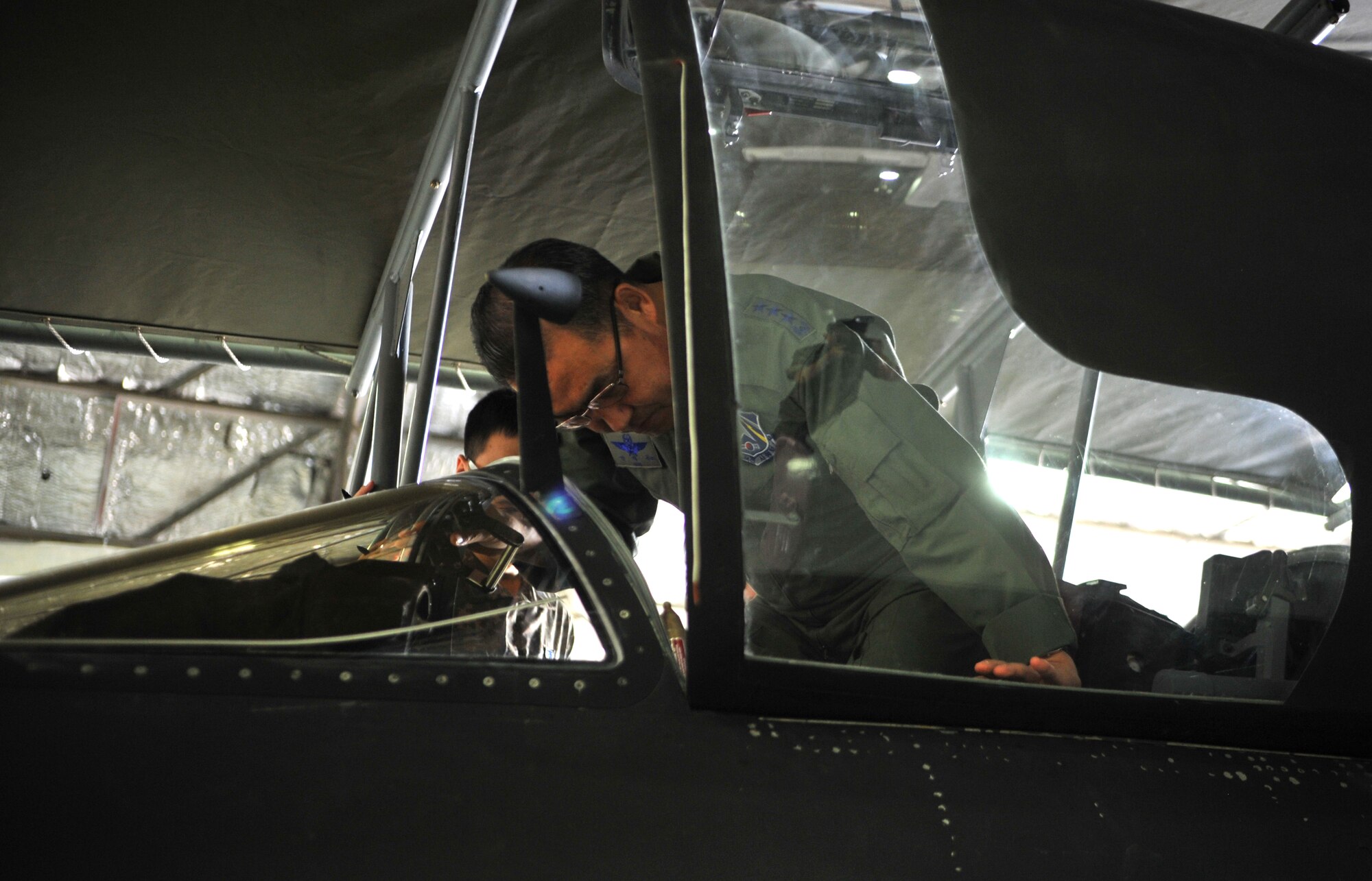 Republic of Korea air force Lt. Gen. Jae-Bock Park, ROK Air Force Operations Command commander, lowers himself into the cockpit of a U-2 Dragon Lady during an immersion tour of the 5th Reconnaissance Squadron at Osan Air Base, ROK, June 11, 2014. Park also toured the Combined Defense Operations Center during the tour. (U.S. Air Force photo/Airman 1st Class Ashley J .Thum)  
